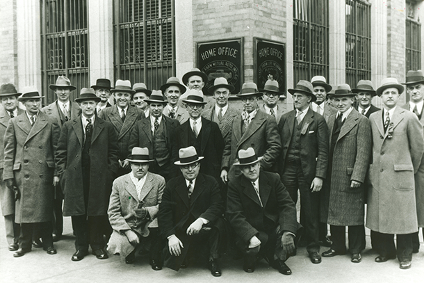 State Farm employees and agents gather outside of the home office.